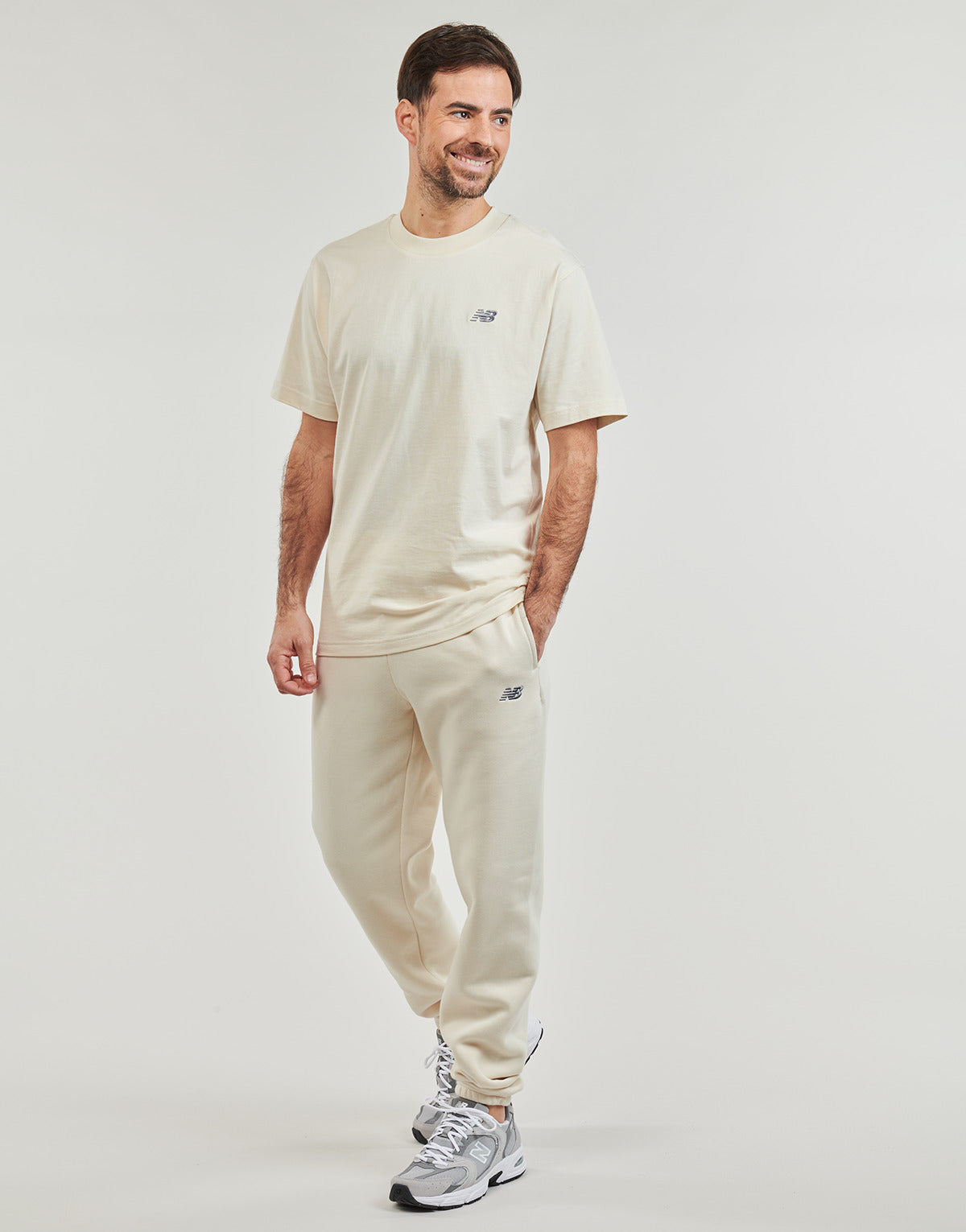 Pantaloni Sportivi Uomo New Balance  FLEECE JOGGER  Beige