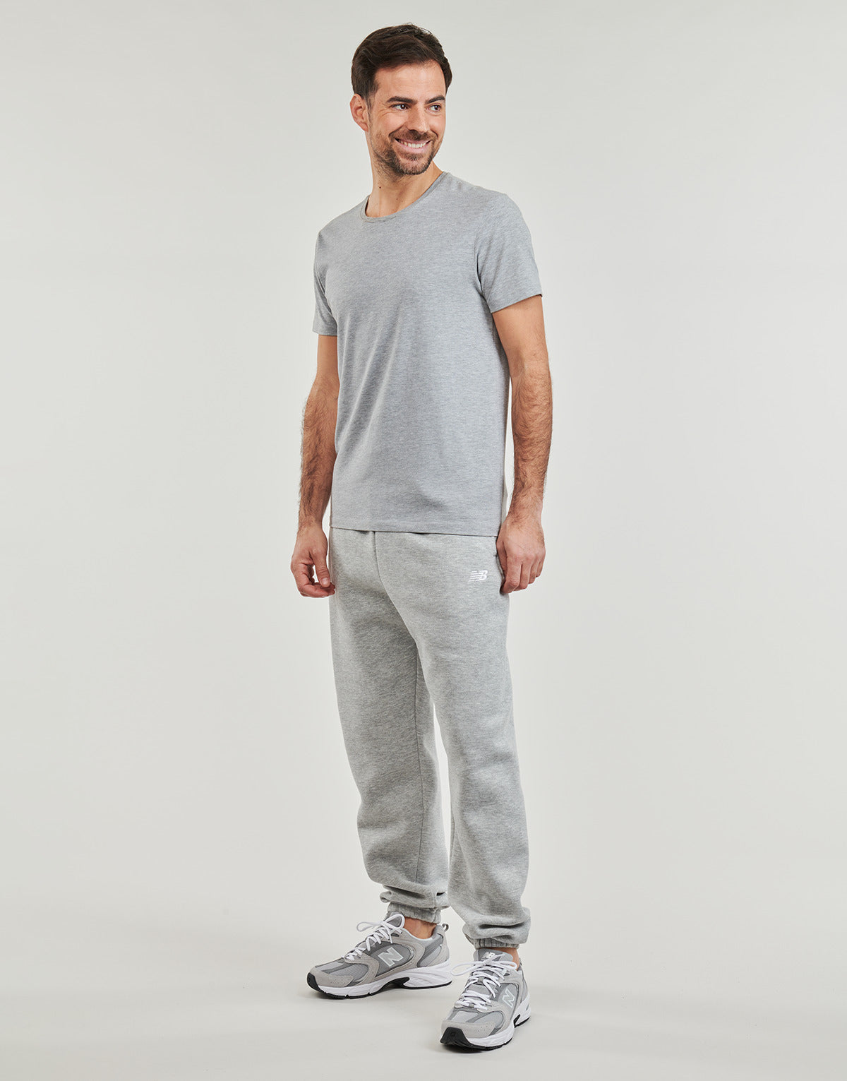 Pantaloni Sportivi Uomo New Balance  FRENCH TERRY JOGGER  Grigio