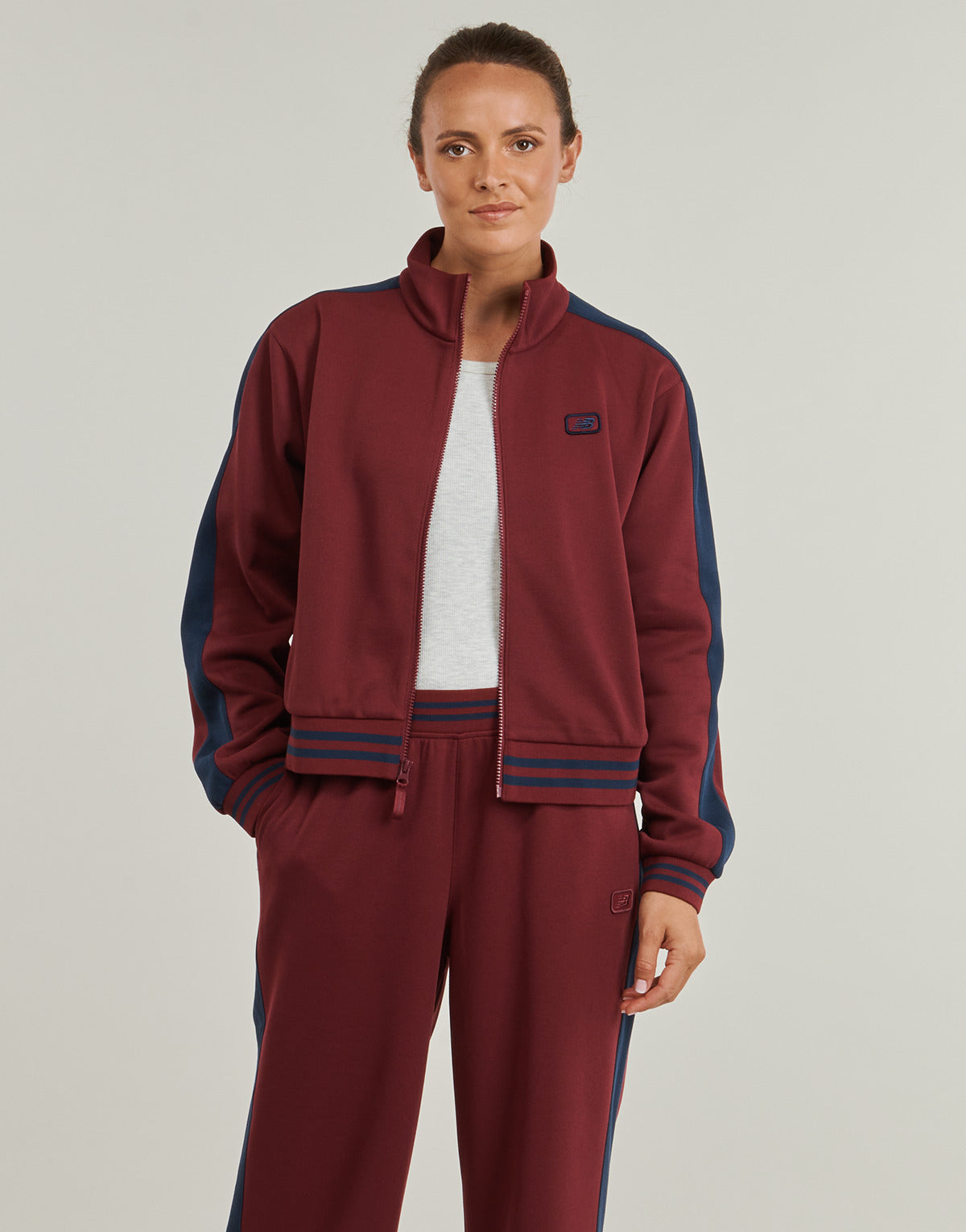 Giacca Sportiva Donna New Balance  POST SEASON PIQUE TRACK JACKET  Rosso