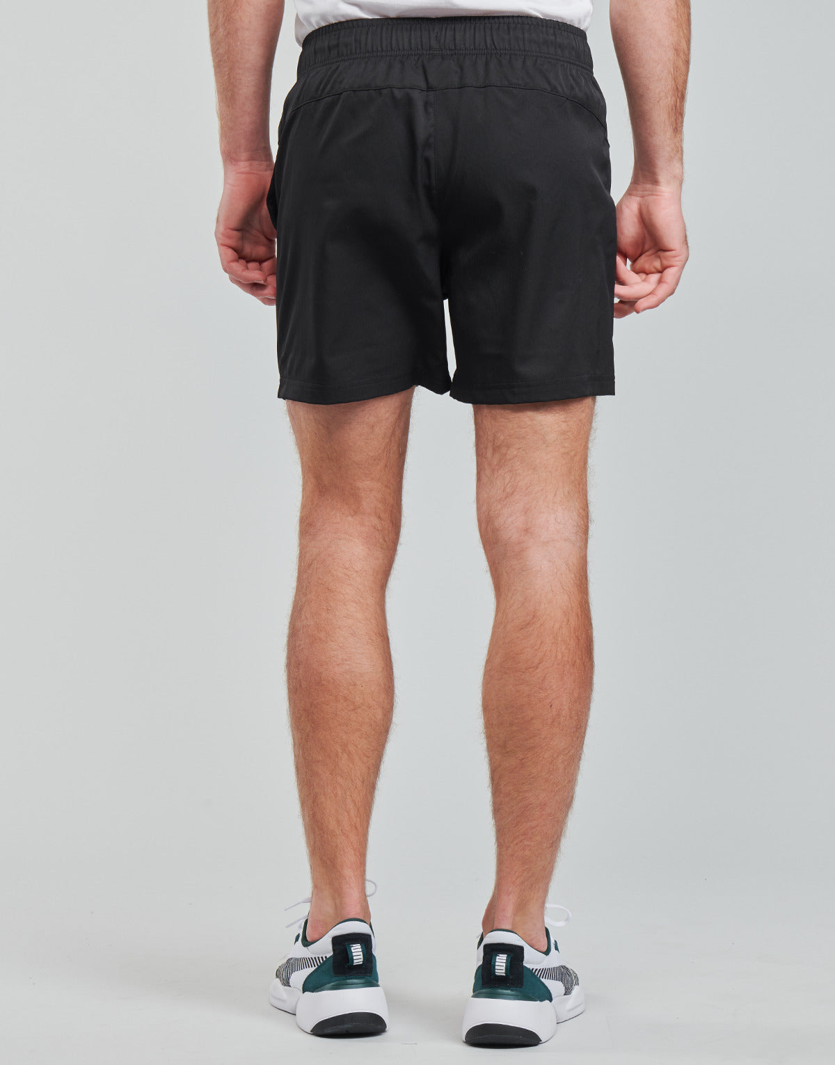 Pantaloni corti Uomo Puma  ESS ACTIVE WOVEN SHORT  Nero