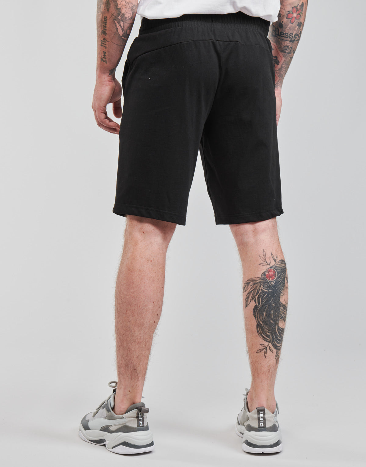 Pantaloni corti Uomo Puma  ESS JERSEY SHORT  Nero